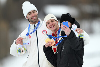 LIVIGNO, ITALY - FEBRUARY 10: Gold medalist Birk Ruud of Team Norway (C), Silver medalist Alex Hall of Team United States (L) and Bronze medalist Luca Harrington of Team New Zealand (partially blocked) celebrate by taking a victory selfie during the medal ceremony for the Men's Freeski Slopestyle Final on day four of the Milano Cortina 2026 Winter Olympic games at Livigno Air Park on February 10, 2026 in Livigno, Italy. (Photo by David Ramos/Getty Images)