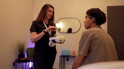 Clinician showing a patient how to use their Healium relaxation training kit